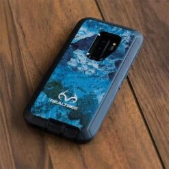 RealTree Xtreme Blue Camo Otterbox Defender Galaxy Skin -Skinit Store xtreme blue camo otterbox defender galaxy s9 plus skin 1698327571 SKNRELTRE09OBS9PD PR 04